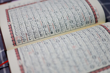 Quran, Al Qur'an, Islamic background for Eid al-Fitr Eid al-Adha. Open page of Al-Quran. Islamic concept