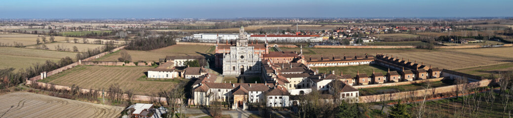 Fototapeta na wymiar Aerial shot of Certosa di Pavia cathedral a historical monumental complex that includes a monastery and a sanctuary. Pavia ,Italy.