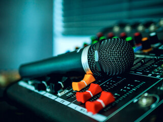 Close-up  microphone on sound mixer in live broadcasting studio producer for sound record control...