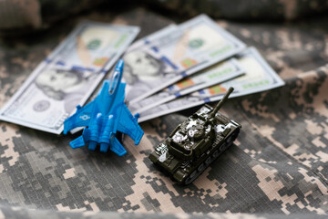 Toy tank with camouflage color . Military vehicles toy. Simple cheap toys for children , warfare,...