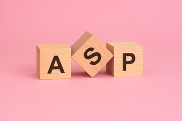 text acronym ASP - Average Selling Price on wooden cubes, on a pink background