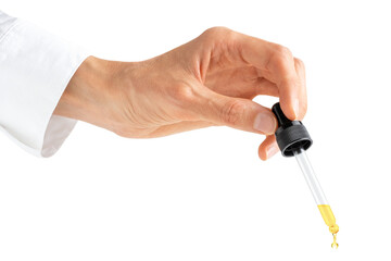 Scientist hand holding pipette dropper with essential oil or serum isolated on white or transparent background.