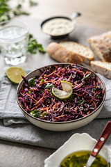 Healthy salad of red cabbage, carrots, coriander and sesame.  Healthy eating, vegan food concept