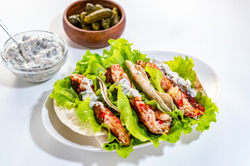 Homemade Mexican tacos with crab sticks and fresh herbs. Healthy food. Traditional Mexican dish.