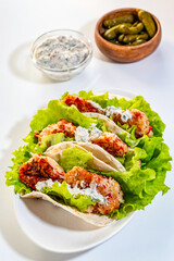 Homemade Mexican tacos with crab sticks and fresh herbs. Healthy food. Traditional Mexican dish.