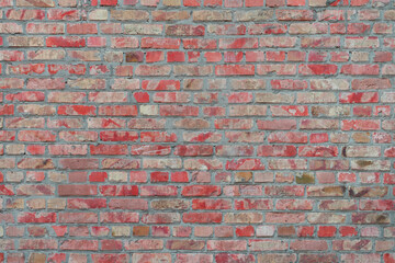 Old red painted brick wall texture background, architectural element, masonry, brickwork. Backdrop, wallpaper.