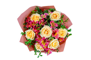Bouquet of yellow roses and pink alstroemeria wrapped in red paper cone isolated on white, transparent  background. Floral shop, gift, romantic holiday concept. Top view, flat lay.