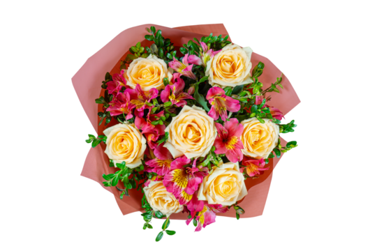 Bouquet of yellow roses and pink alstroemeria wrapped in red paper cone isolated on white, transparent  background. Floral shop, gift, romantic holiday concept. Top view, flat lay.