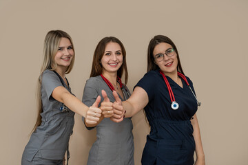 Medical team with three woman doctor  standing together at isolated background