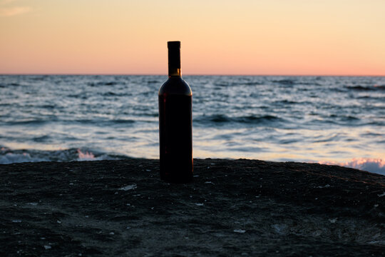 Bottle of wine at sunset.