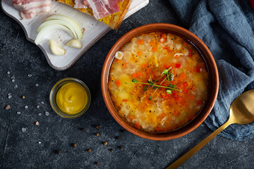 Minestrone soup. Vegetable soup with grilled bread, ham and spices