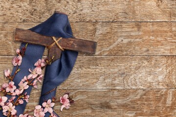 Easter wooden cross with fresh flowers