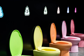 Eye-catching display of modern toilets in a spectrum of vibrant colors, illuminating creative...
