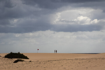 Beach with red flag.