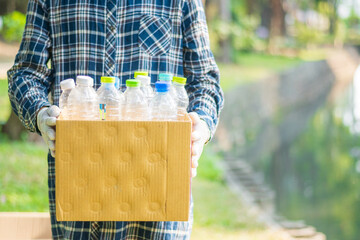 Store waste plastic bottles in cardboard boxes.