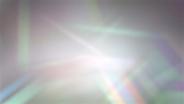 refracted prism light beams in rainbow colors for abstract luxurious backgrounds, backdrop for gemstones such as diamonds, sun rays and lens flares slow motion 