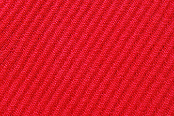 Soft red color ribbed jersey fabric pattern close up as background