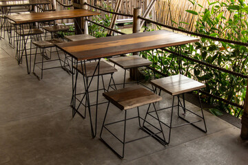 Fototapeta premium Wooden table and chairs in empty