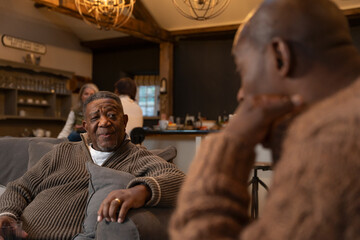 Men talking in living room