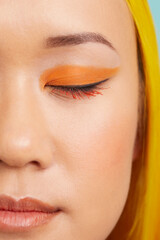 Young woman with orange make up