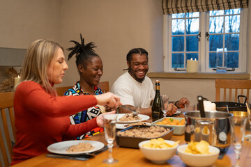 Friends having meal at home 