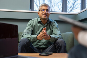 Mature businessman sitting in office