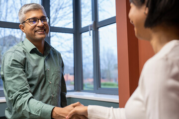 Business people shaking hands in office