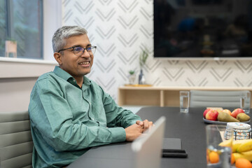 Mature businessman sitting in conference room