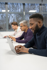Businessmen working at desk in office