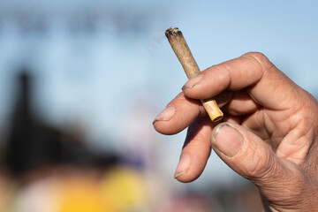 hand holding a marijuana joint, mallorca, spain