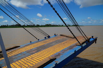 Front loading flap with support ropes of a steel ferry and a cargo ship traveling up and down the Amazon River in Brazil. Juriti, Para state, Brazil.