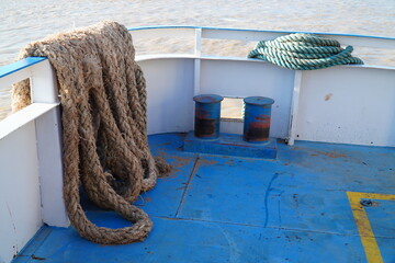 Folded up old mooring lines on a cargo ship. Strongly braided ropes for mooring and anchoring on...