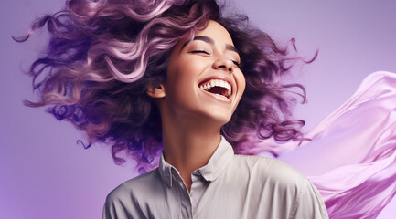 Joyful young woman with vibrant curly hair and a contagious smile