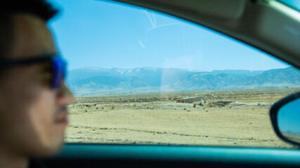 Wuwei City, Gansu Province - Wind power generation, roads and mountains under the blue sky