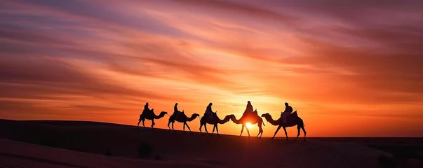 Fototapeten Desert landscape at sunset on a sunny afternoon with camels running © diwek