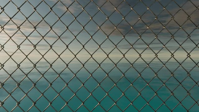 A 3D-rendered scene featuring a detailed chain-link fence against a vast ocean and sky background while a camera moving passing through the fence