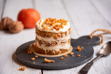 Small carrot cake on white background