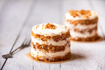 Small carrot cakes on white background