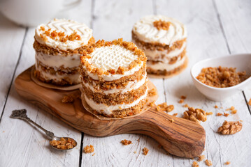 Small carrot cakes on white background