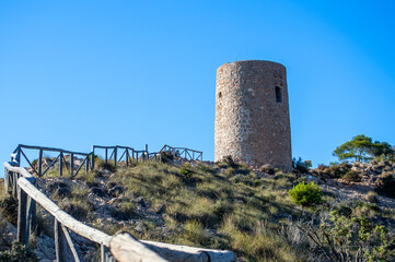 Mediterranean coastal landscape. Historic Torre Vigia De Cerro Gordo, a watchtower looking out for any marauding pirates. La Herradura, Andulasia, Southern Spain