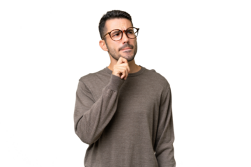 Young handsome caucasian man over isolated background having doubts and thinking