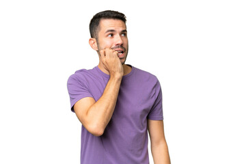Young handsome caucasian man over isolated background is a little bit nervous