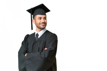 Young university graduate man over isolated background with arms crossed and happy