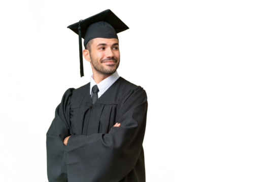 Young university graduate man over isolated background with arms crossed and happy