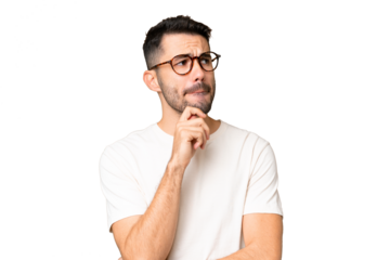 Young handsome caucasian man over isolated chroma key background having doubts and thinking