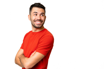 Young handsome caucasian man over isolated chroma key background with arms crossed and happy