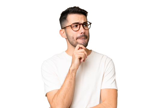 Young handsome caucasian man over isolated chroma key background having doubts and thinking