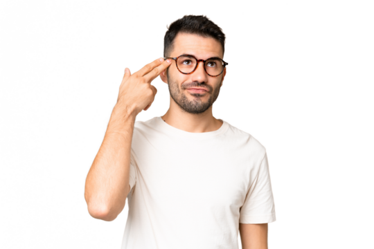 Young handsome caucasian man over isolated chroma key background with problems making suicide gesture