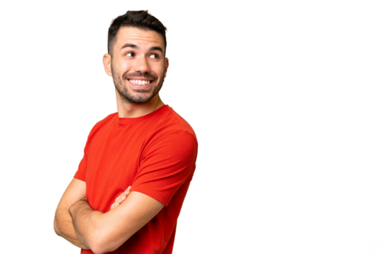 Young handsome caucasian man over isolated chroma key background with arms crossed and happy