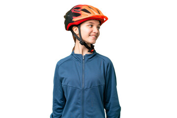 Teenager cyclist girl over isolated chroma key background looking side - obrazy, fototapety, plakaty